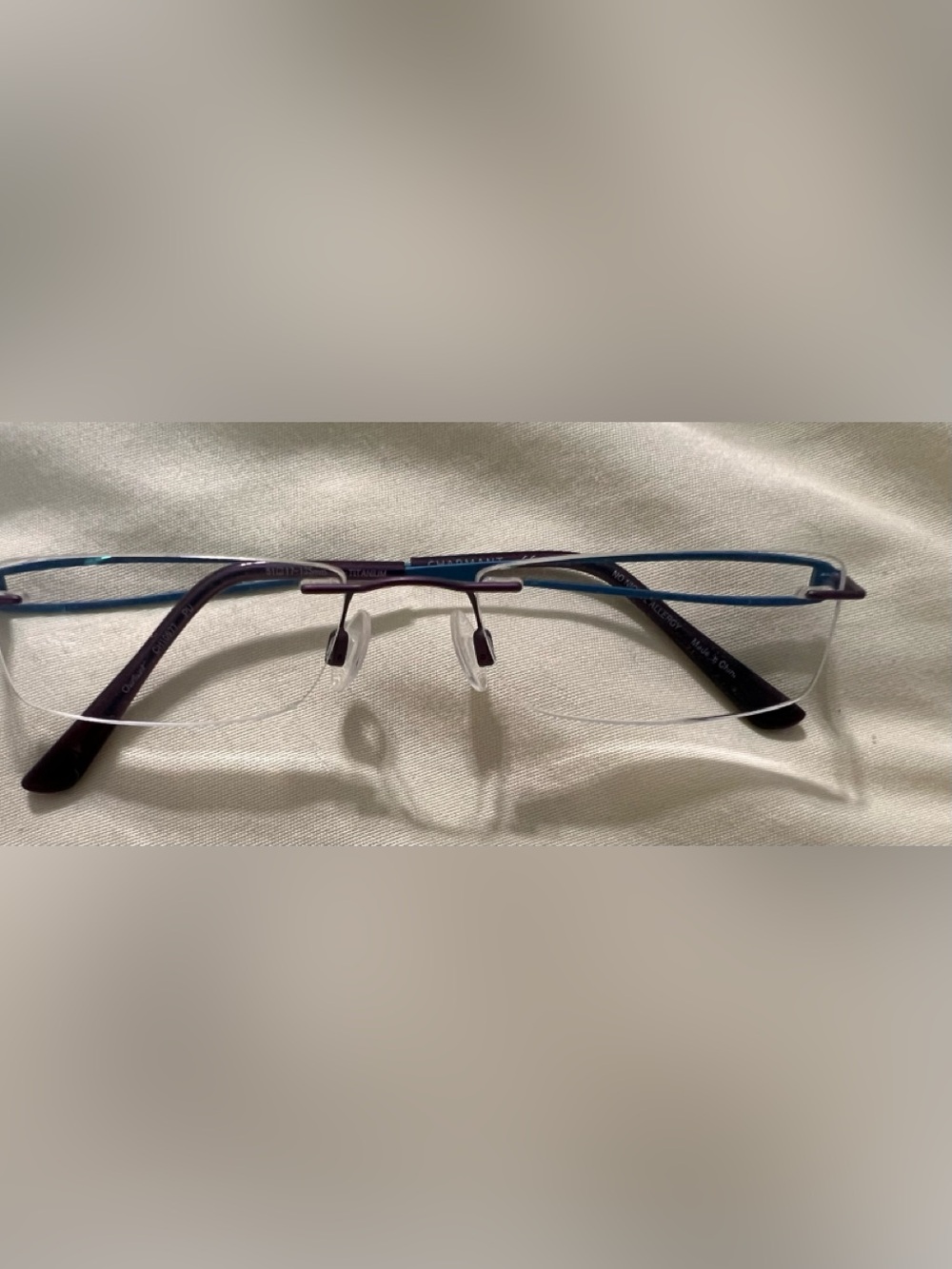 Charmant brand Rimless Eyeglasses in Purple and Teal. Lightweight high quality